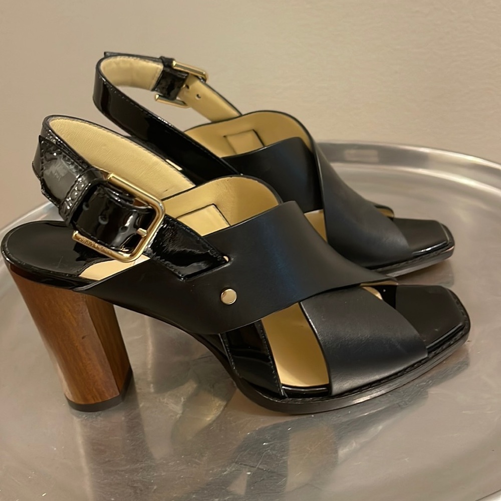 Authentic jimmy choos! Made in Italy! Black leather shoe with brown heel.